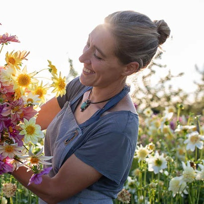 Author - Erin Benzakein showing the dahlias grown on Floret Farm