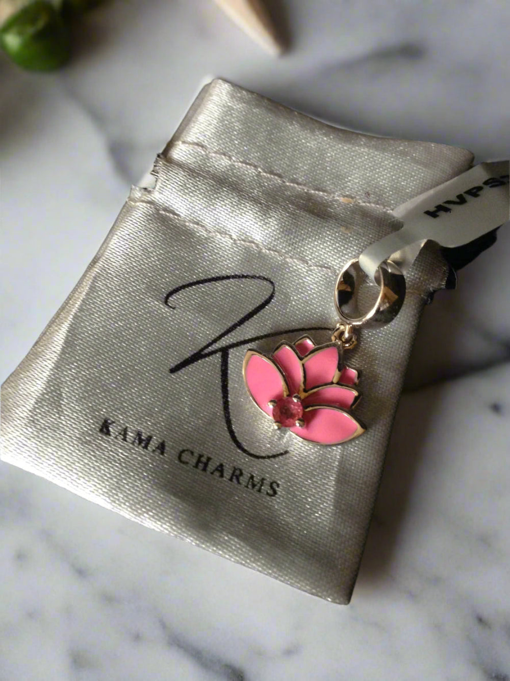 Pink Tourmaline & Sterling Silver, Kama Lotus Charm front face and bag