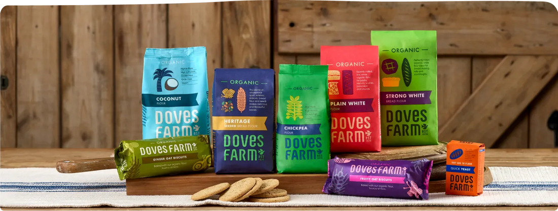 Doves Farm product range including Ascorbic Acid Vitamin C powder, displayed on a natural surface