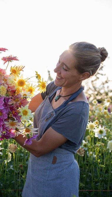 Author - Erin Benzakein showing the dahlias grown on Floret Farm 
