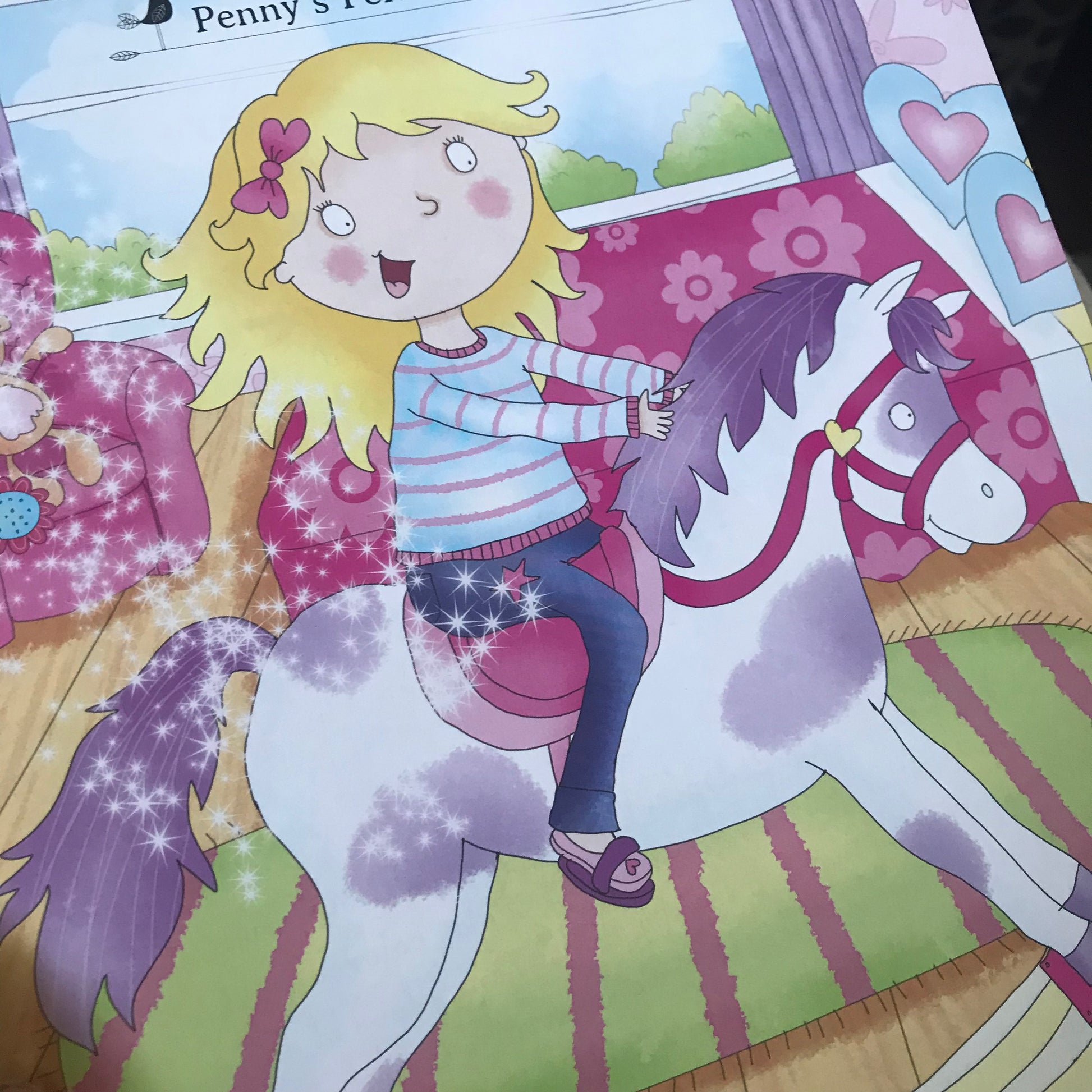 Bedtime Stories for girls:- Example of full colour book illustrations: a picture of a girl riding a unicorn in a colourful room.