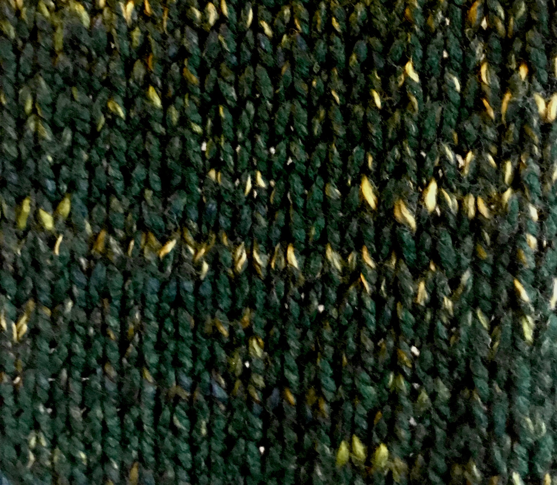 Close up of stitch pattern, and overall forest green colour 