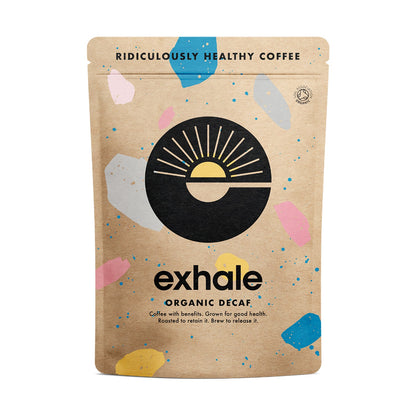Exhale Organic Decaf coffee package with abstract shapes on a beige background