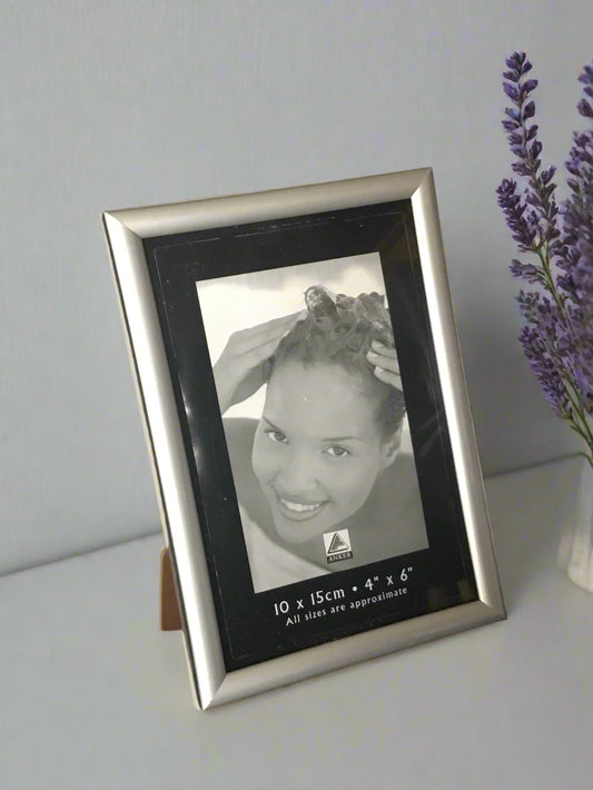 Silver Coloured, Modern Photo frame - 10x15cm displayed standing on surface