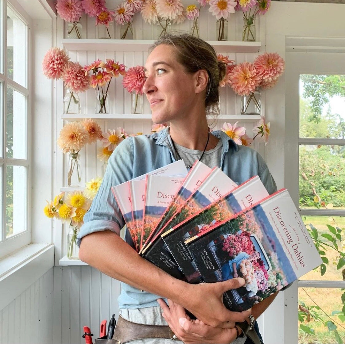 The author in her studio in front of her farm grown dahlias | Floret Farm Discovering Dahlias  