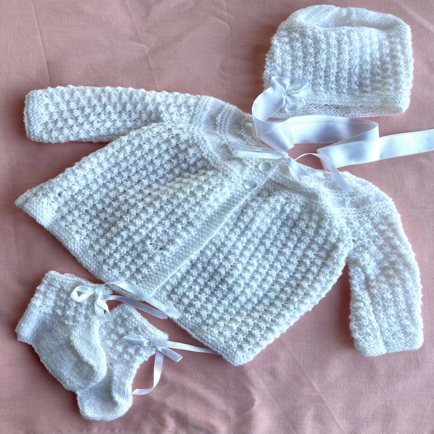 Flat lay - showing baby layette set - ‘Created by Lel’ - Local Artisan