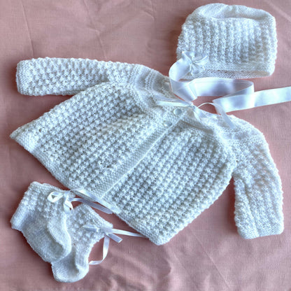 Flat lay - showing baby layette set - ‘Created by Lel’ - Local Artisan